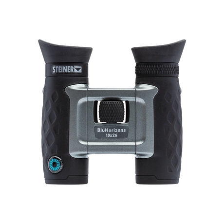 Steiner BluHorizons 10x26 compact binocular, front view showing the silver AutoBright body and BluHorizons 10x26 marking