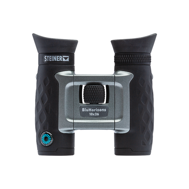 Steiner BluHorizons 10x26 compact binocular, front view showing the silver AutoBright body and BluHorizons 10x26 marking