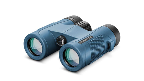 Hawke Endurance ED Marine 7x32 binocular in blue, front three-quarter view showing the compact ED roof-prism body and Endurance ED branding