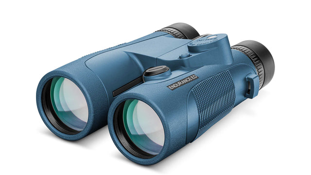 Hawke Endurance ED Marine 7x50 Compass binocular in blue, showing the illuminated compass module on the bridge