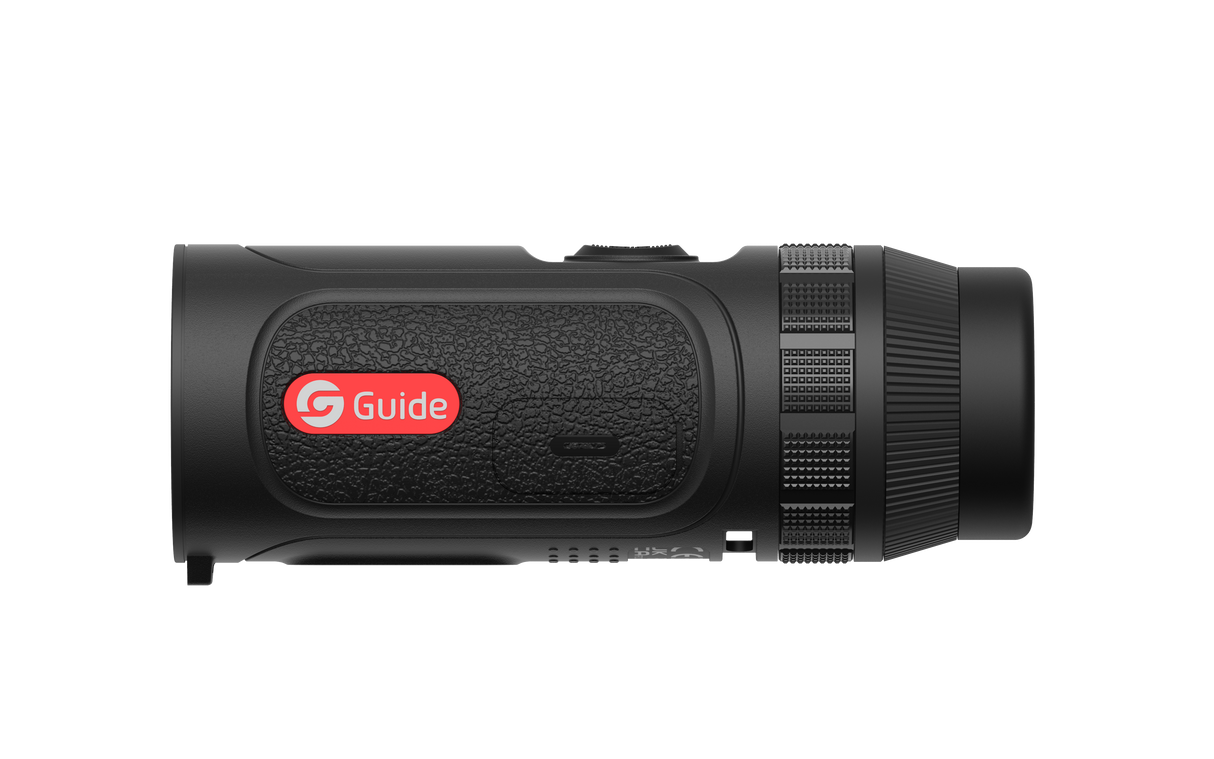 Guide TE211 thermal monocular held in hand showing the pocketable scanner ergonomics