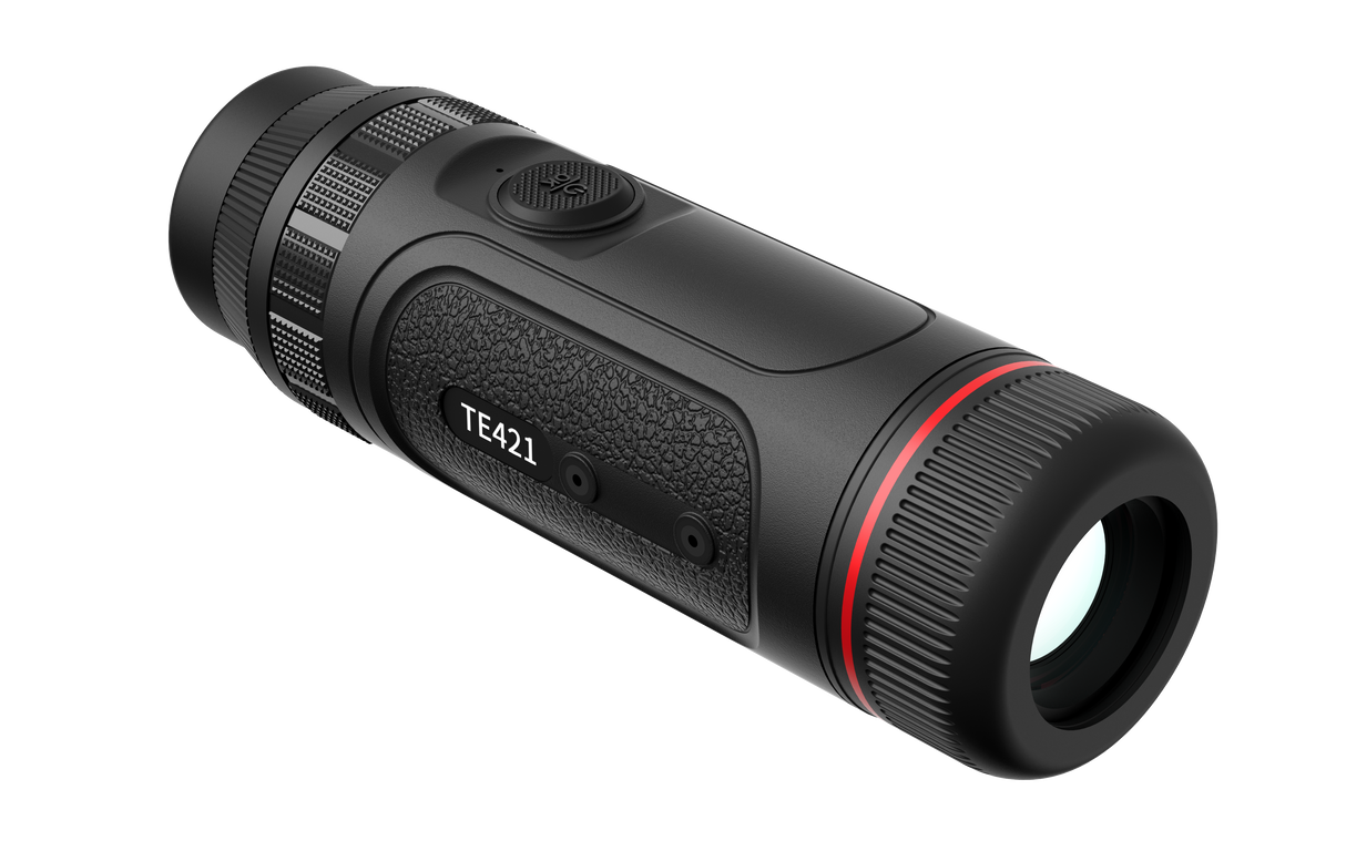 Guide TE421 thermal monocular in hand showing the pocket-sized 295 gram form factor
