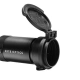 Kite Optics B6 eyepiece flip cover in black, shown open and mounted on a riflescope